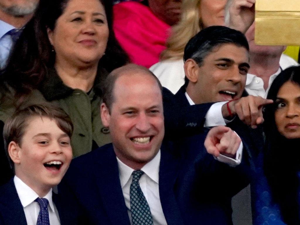 Prince George and Prince William shared a funny moment together. Prime Minister Rishi Sunak and his wife Akshata Murty in the back. Picture: AFP