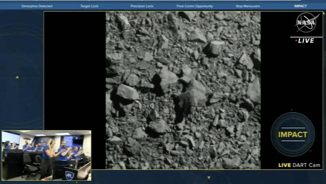 The NASA livefeed shows Dimorphos just before the Double Asteroid Redirection Test (DART) made impact with the asteroid, as watched by the team (bottom L) at DART headquarters in Laurel, Maryland. Picture: AFP.