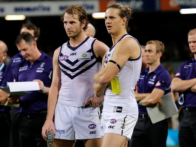 PERTH, WESTERN AUSTRALIA - APRIL 29:  David Mundy and Nat Fyfe of the Dockers look on during the Ross Glendinning medal presentation after the round six AFL match between the West Coast Eagles and the Fremantle Dockers at Domain Stadium on April 29, 2017 in Perth, Australia.  (Photo by Will Russell/AFL Media/Getty Images)