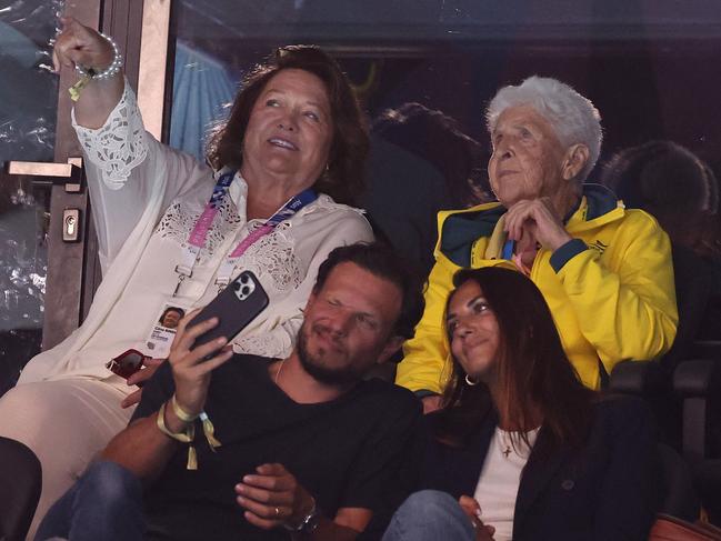 Gina Rinehart and Dawn Fraser watch the swimming action at the Paris La Defense Arena. Picture: Adam Head