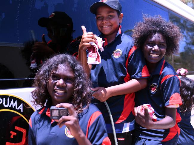 Jasmine Yunipingu,, Richard Williams and Nikesha Mununggur with the new school bus. Picture: Amanda Parkinson