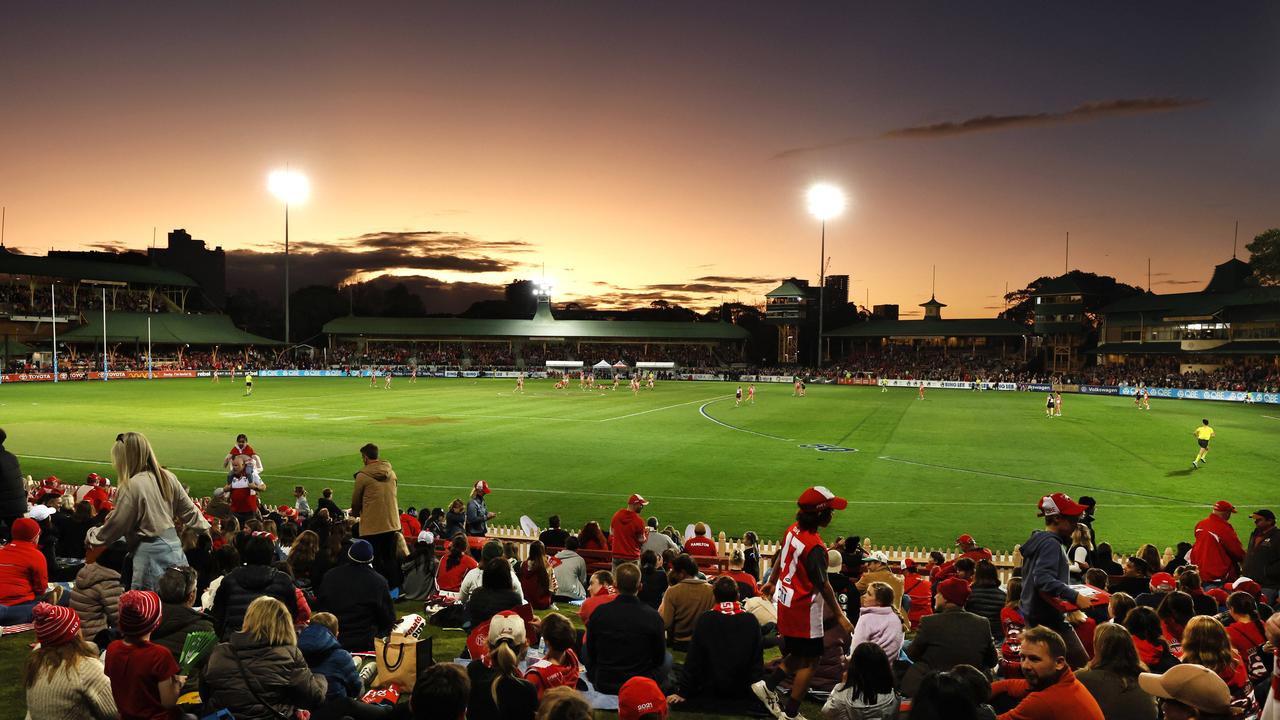 Sunset at North Sydney Oval and a big crowd watches the first ever game for the Sydney Swans. Picture: Phil Hillyard