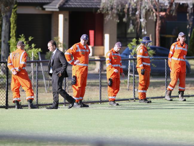 SES carry out a line search of the area. Picture: David Crosling