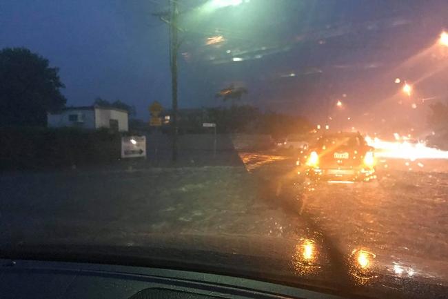 A flooded Runaway Bay street. Picture: Erin Lloyd 