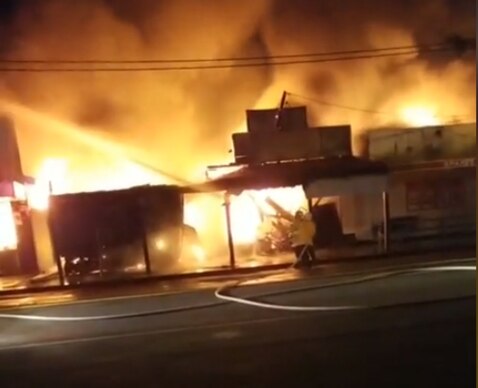 A block of shops has caught light in a rural Queensland border town.