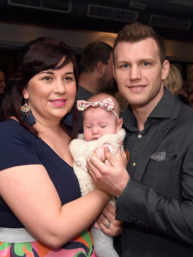 The world champ — pictured with wife Jo and baby daughter Isabelle — narrowly escaped serious injury. Picture: Bradley Kanaris/Getty Images
