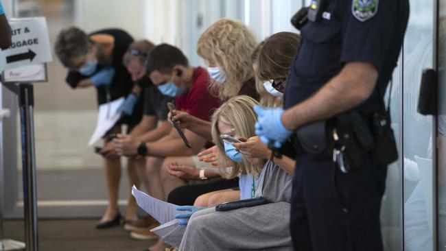 Travellers wait at Adelaide Airport on Monday after SA closed its borders to WA. Picture: Emma Brasier.