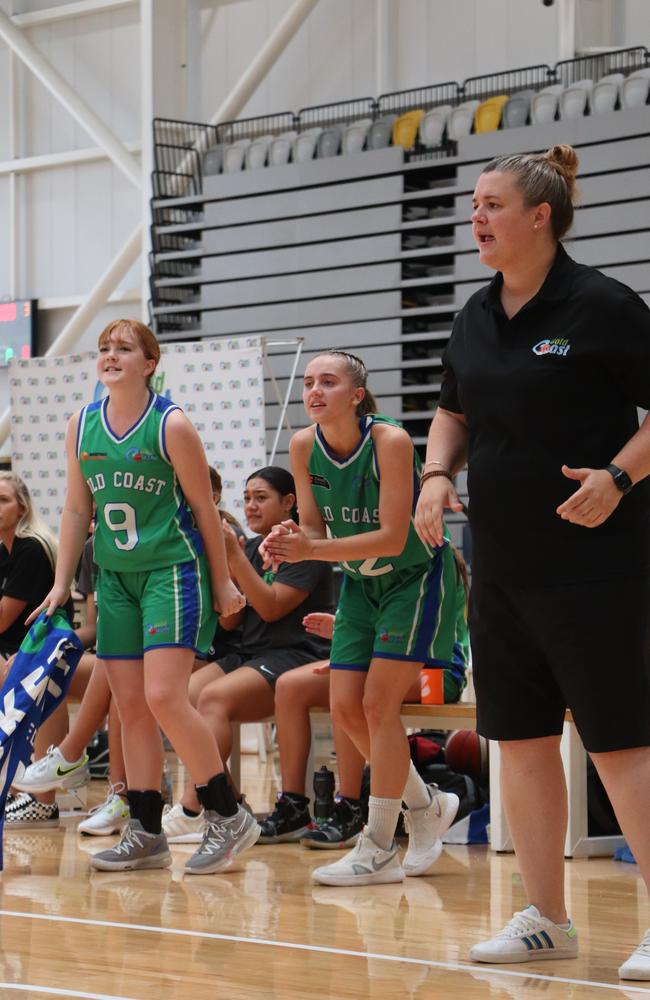 Gold Coast coach Cassie Dover and their bench celebrate during their semi-final win. Picture: Basketball Queensland