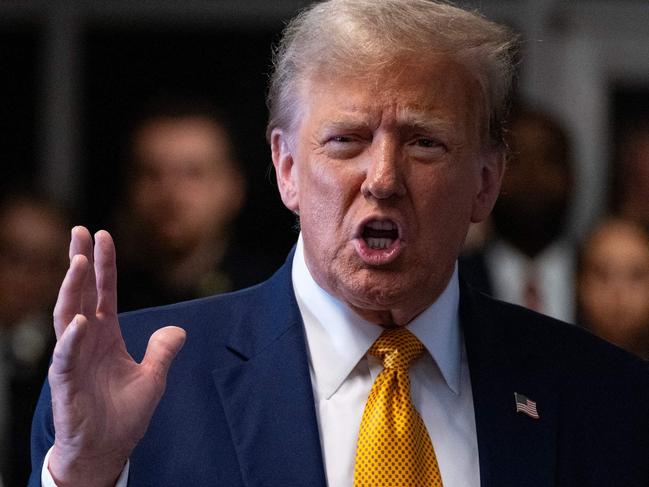 Former US President Donald Trump speaks to the press as he arrives to attend his trial for allegedly covering up hush money payments linked to extramarital affairs, at Manhattan Criminal Court in New York City, on May 14, 2024. Trump's former personal attorney Michael Cohen returns to the witness stand on Tuesday for what is expected to be a tough grilling by the ex-president's lawyers at his historic hush money trial. (Photo by Craig Ruttle / POOL / AFP)