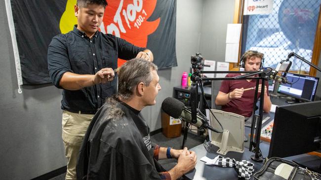 Matt the Barber cutting the Chief Minister's hair on live radio. Picture: Floss Adams.