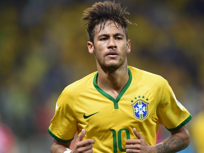 Brazil's forward Neymar runs during a Group A football match between Brazil and Croatia at the Corinthians Arena in Sao Paulo during the 2014 FIFA World Cup on June 12, 2014. AFP PHOTO / VANDERLEI ALMEIDA