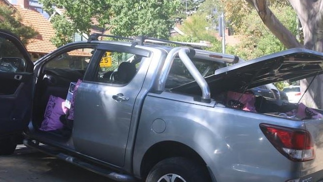 Mr Lehrmann’s belongings being packed into a ute outside the house on Friday morning. Picture: news.com.au