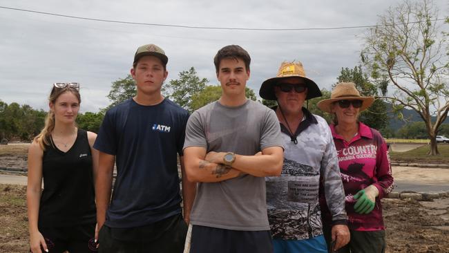 Staff member Bronte Hannam, volunteer Seth Hallett, Cairns Kart Hire events manager Tyson Krepp and volunteers Adam Hallett and Alanna Stirling have spent time cleaning out the facilities at Cairns Kart Hire after extensive flooding tore through the Far North. Photo: Catherine Duffy.