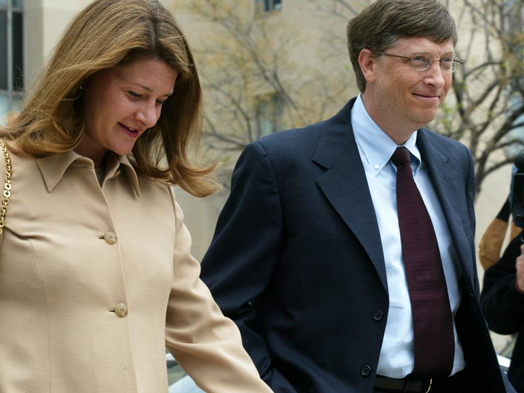 Bill Gates arriving at the U.S. District Court with his wife Melinda in 2002 during an antitrust case against Microsoft. Picture: Alex Wong/Getty Images)