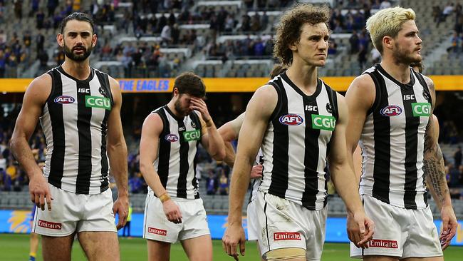 PERTH, AUSTRALIA - JULY 26: Collingwood leave the field after the teams defeat during the round 8 AFL match between the West Coast Eagles and the Collingwood Magpies at Optus Stadium on July 26, 2020 in Perth, Australia. (Photo by Will Russell/AFL Photos/via Getty Images)