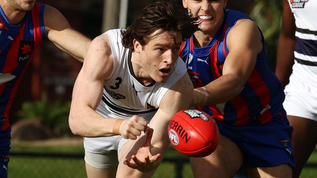 Northern Knights’ Josh Ward clears by hand. Picture: Michael Klein