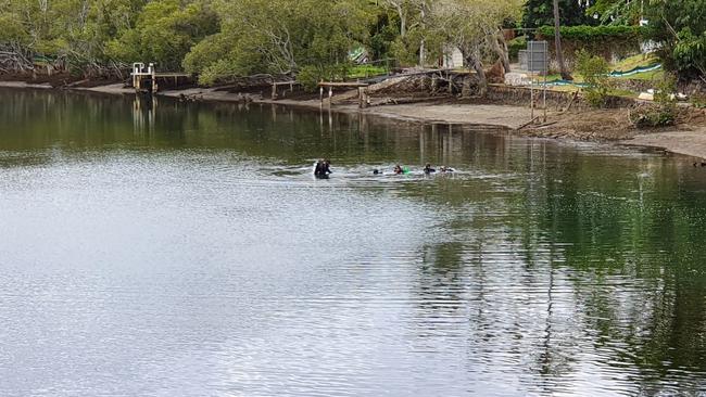 Police divers near the scene where the body of bikie Shane Ross was found. Picture: Chris McMahon