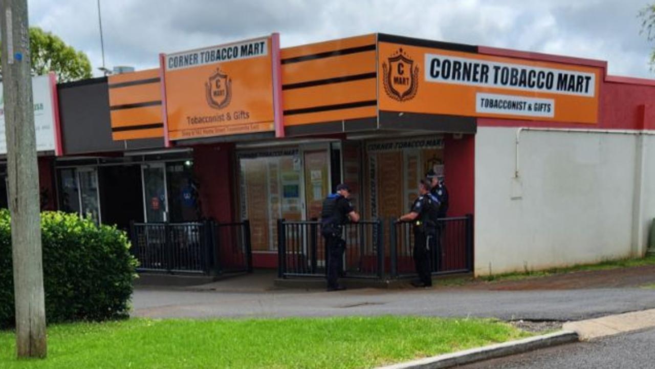 Police outside the Corner Tobacco Mart on Hume Street in Toowoomba City.