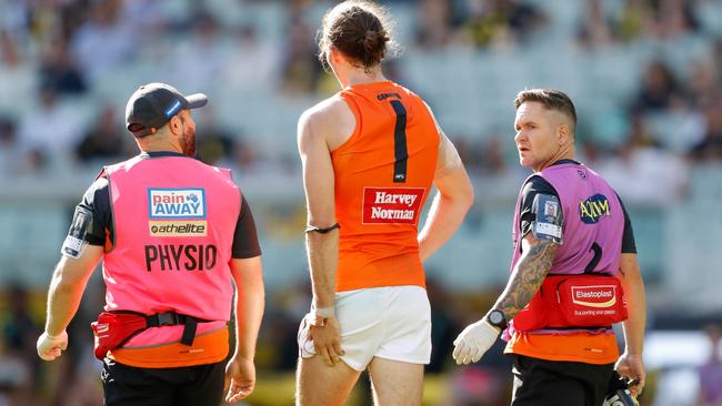 Phil Davis walks off the MCG after suffering his hamstring injury. Picture: Getty Images