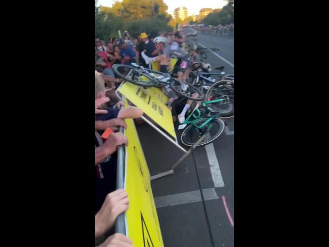 Fan hospitalised following nightmare crash in Tour Down Under