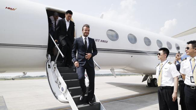 Former British soccer champion David Beckham departs his private jet at Nanjing airport in 2013. Picture: Getty Images