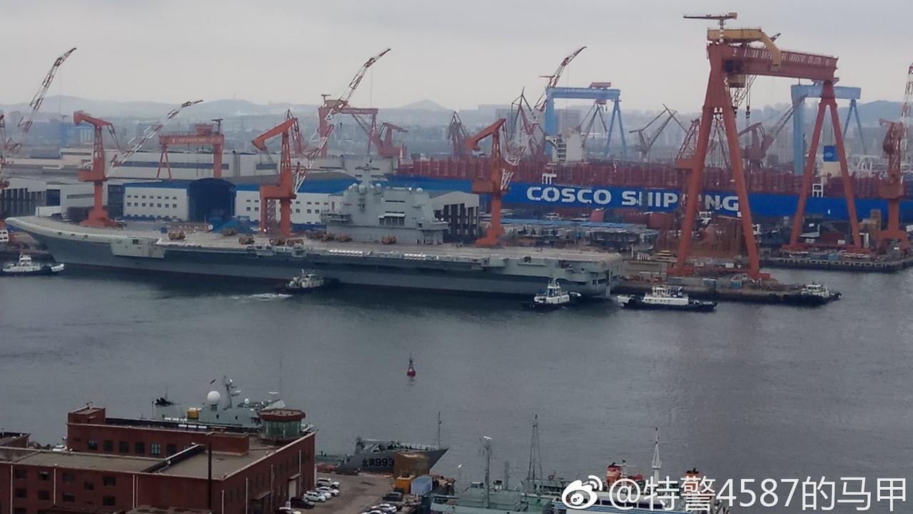 Tugboats are seen moving China's new, home-built, aircraft carrier - known as Type 001A (CV-17) - away from its dock in preparation for its first at-sea tests. Picture: Weibo