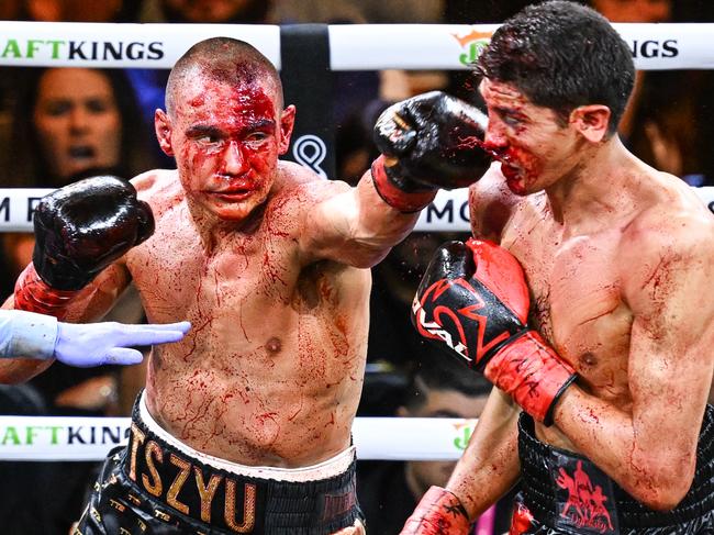 LAS VEGAS, NV - MARCH 30: (EDITORS NOTE: Image depicts graphic content) Tim Tszyu (in gold & black short) and Sebastian Fundora (in red & black short) exchange punches during their super welterweight world titles of the Premiere Boxing Championship on Saturday night as Sebastian Fundora wins at the T-Mobile Arena in Las Vegas, Nevada, United States on March 30, 2024. (Photo by Tayfun Coskun/Anadolu via Getty Images)