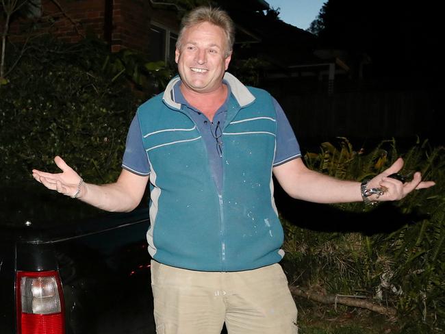 Andrew MacRae arrived home in his ute to find the Daily Telegraph on his doorstep in Lane Cove this evening. Picture: Adam Taylor