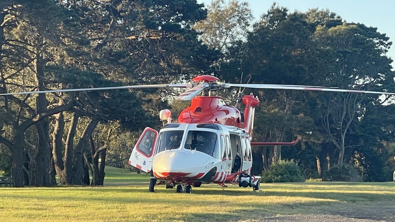 A helicopter lands on an oval on Ward Street to transport the man to hospital.