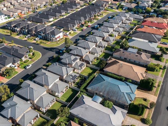 Aerial view of rows of mass produced 'cookie cutter' style homes build during the 2010s in outer suburban Sydney, Australia.