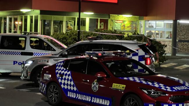 The scene where a teenage male received treatment for a gunshot wound at Helensvale Plaza Monday night. Picture: Keith Woods