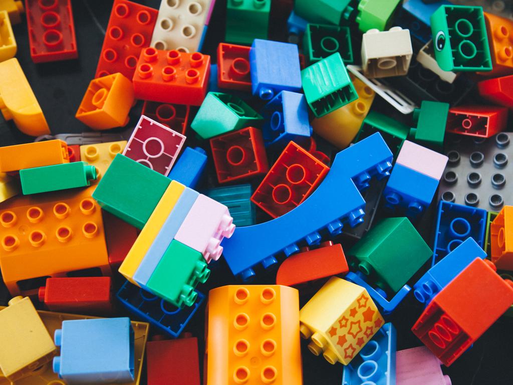 Istanbul, Turkey - February 12, 2016: Colorful Lego building bricks and blocks on white background. The Lego toys were originally designed in the 1940s in Denmark and have achieved an international appeal.