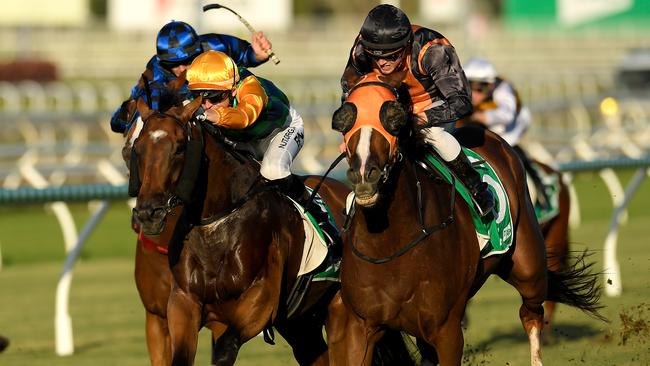 Jockey Jackson Murphy rides Benfica Princess (right) to victory in race 8, the BenchMark 80 Handicap, during Saturday Raceday at Eagle Farm Racecourse in Brisbane, Saturday, March 21, 2020. (AAP Image/Albert Perez) NO ARCHIVING, EDITORIAL USE ONLY