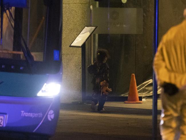 A young girl from Afghanistan holding a stuffed animal arrives at the Hyatt Hotel in Perth after evacuating Kabul. Picture: Getty Images