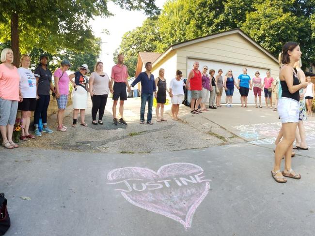 Locals mourn the death of Ms Damond following her shooting on Saturday night.