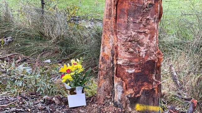 Flowers are seen left at the scene where a man has died after crashing his car into a tree on Kersbrook Road near Bagshaw Road, Kersbrook. Picture: Russell Millard