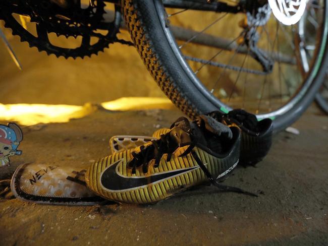 Soccer shoes were left outside of the cave entrance. Picture: AP
