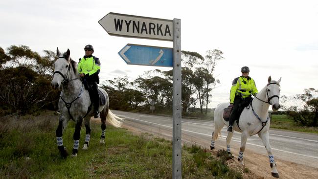 Mounted police search the Karoonda Highway around Wynarka as part of their investigation into the murder of a little girl whose body was found in a suitcase.