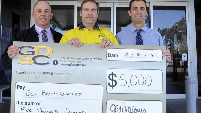 FOR BEN: Shane Whalley accepts $5000 from the GDSC&#39;s CEO Garry Williams and Michael Sear to help with his son, Ben Baker-Whalley&#39;s cancer treatment. Picture: Caitlan Charles