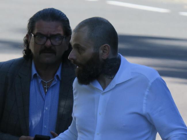 Salim Moujalli (right), 46, of Point Frederick, arriving at an earlier appearance at Gosford District Court with a supporter. Picture: NewsLocal