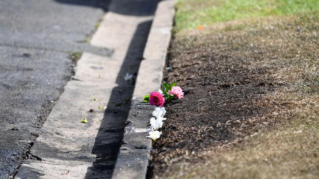 Flowers are left at the scene. Picture: AAP