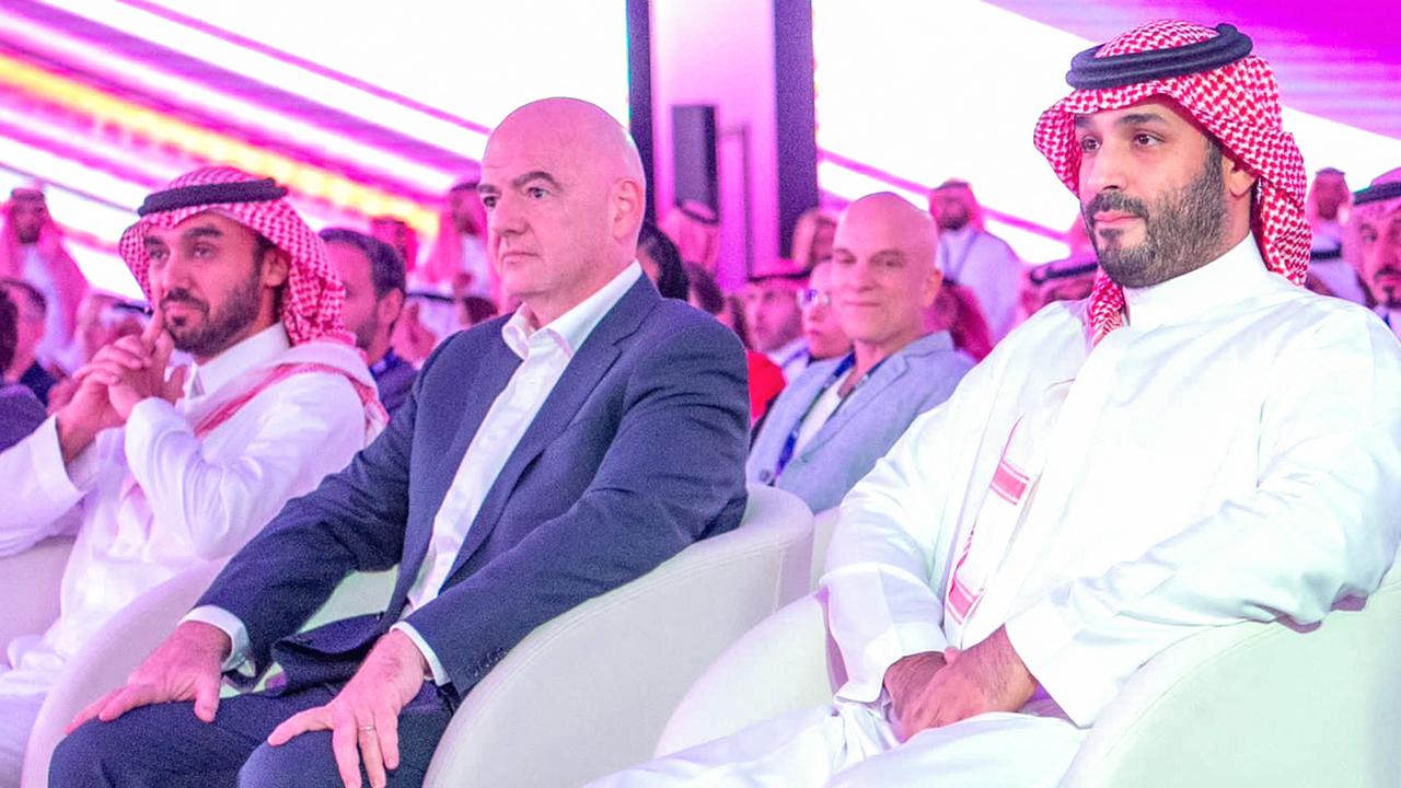 This handout picture provided by the Saudi press Agency (SPA) on October 23, 2023 shows Saudi Crown Prince Mohammed bin Salman MBS (R) and FIFA President Gianni Infantino (C) attending the launch of the Esports World Cup in Riyadh. Saudi Arabia said on October 23 it would organise an eSports World Cup starting next year, the latest boost to a sector Riyadh hopes will create tens of thousands of local jobs. (Photo by SPA / AFP)