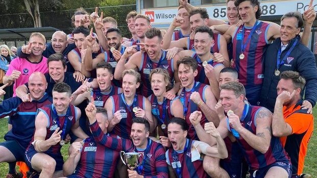 PEGS seniors celebrate their division one premiership win over Old Camberwell Grammarians. (Picture: Supplied)