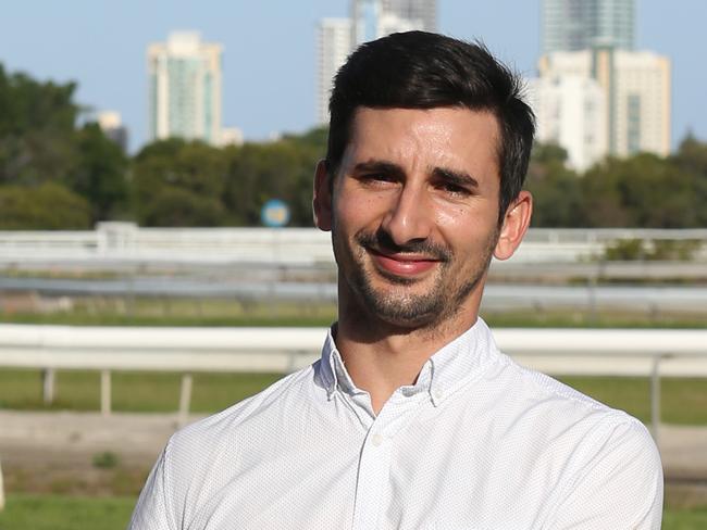 Trainer Michael Costa of New Breed Racing, who relocated to the Gold Coast poses with his 3-year-old gelding Stanley at the Gold Coast Turf Club, Gold Coast. Photo: Regi Varghese