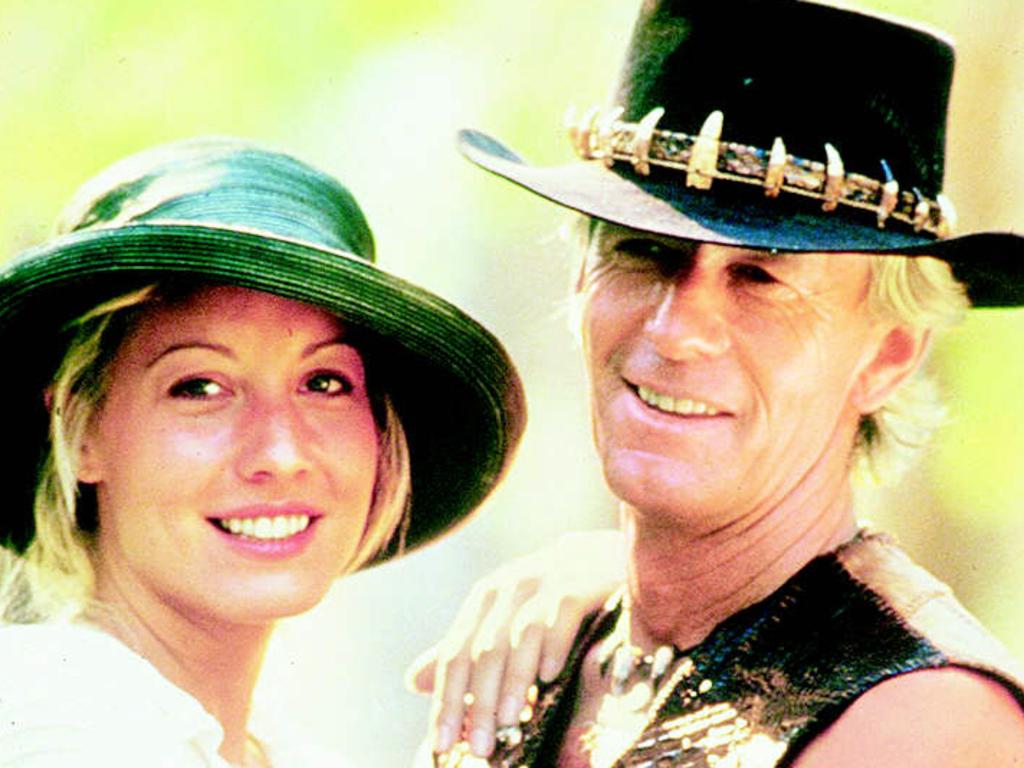 Actor Paul Hogan (as Mick Dundee)  (r) with actress Linda Kozlowski  in scene from film 