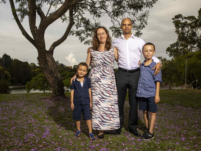 16 January 2020.Thuthuka Manasa, wife Harriet Swatman and their two sons Matobo and Magnus stand in front of Jacaranda trees at St Lucia, Brisbane.Photo: Glenn Hunt / The Australian