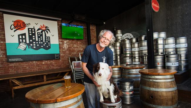 Alistair Carragher, pictured with his dog Bozo, owns the Great Northern Hotel in Carlton North and has been inundated with bookings for Grand Final Day. Picture: Paul Jeffers