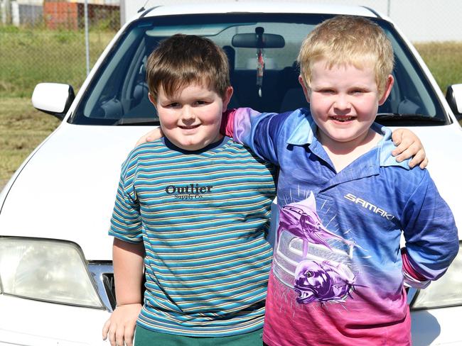 Tatum Glindemann, 5, and Kody Hodson, 6, watch the The Transporter Parade in Townsville. Picture: Shae Beplate.