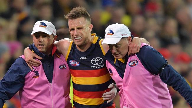 Brodie Smith hits the deck after rupturing his anterior cruciate ligament against GWS in last year’s qualifying final. Picture: Sarah Reed