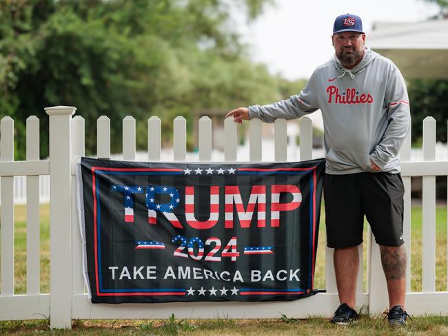 Electrical engineer Tim Lennon, 49, stands near his Trump sign in Montgomery County in southeastern Pennsylvania. Picture: Hannah Beier